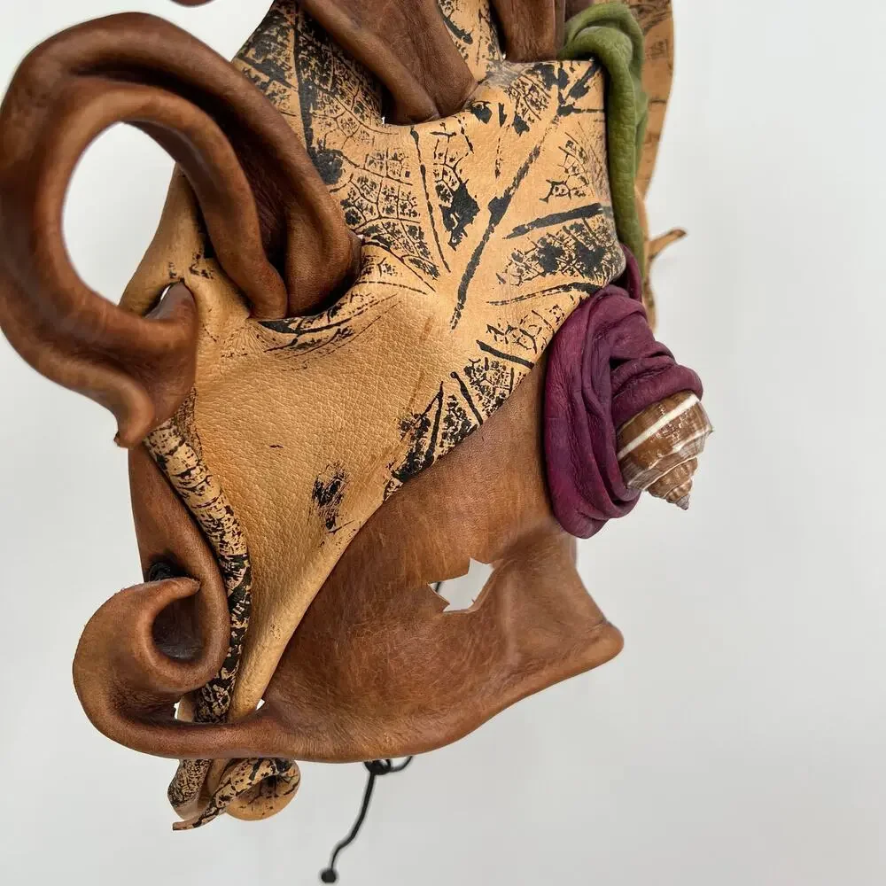 Vintage handcrafted leather masquerade mask with shell